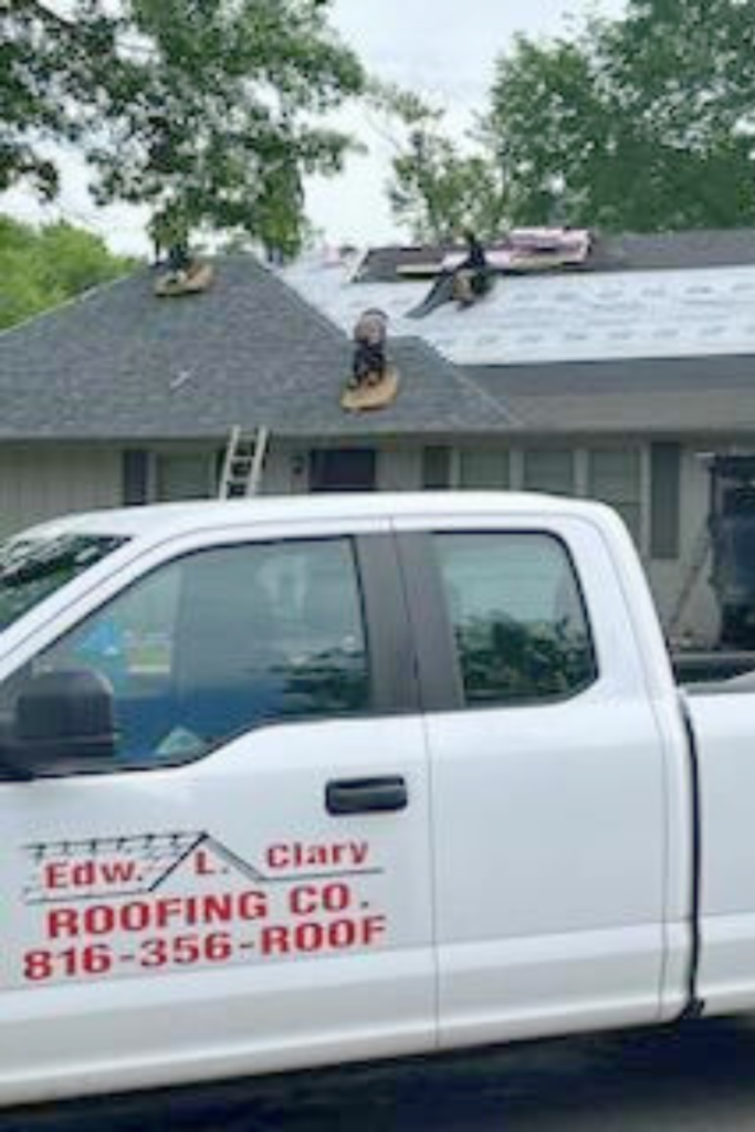 Roofers working on new roof on residential home in Kansas city