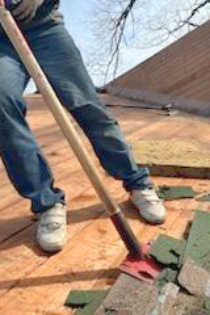 Roofers working on new roof on residential home in Kansas city