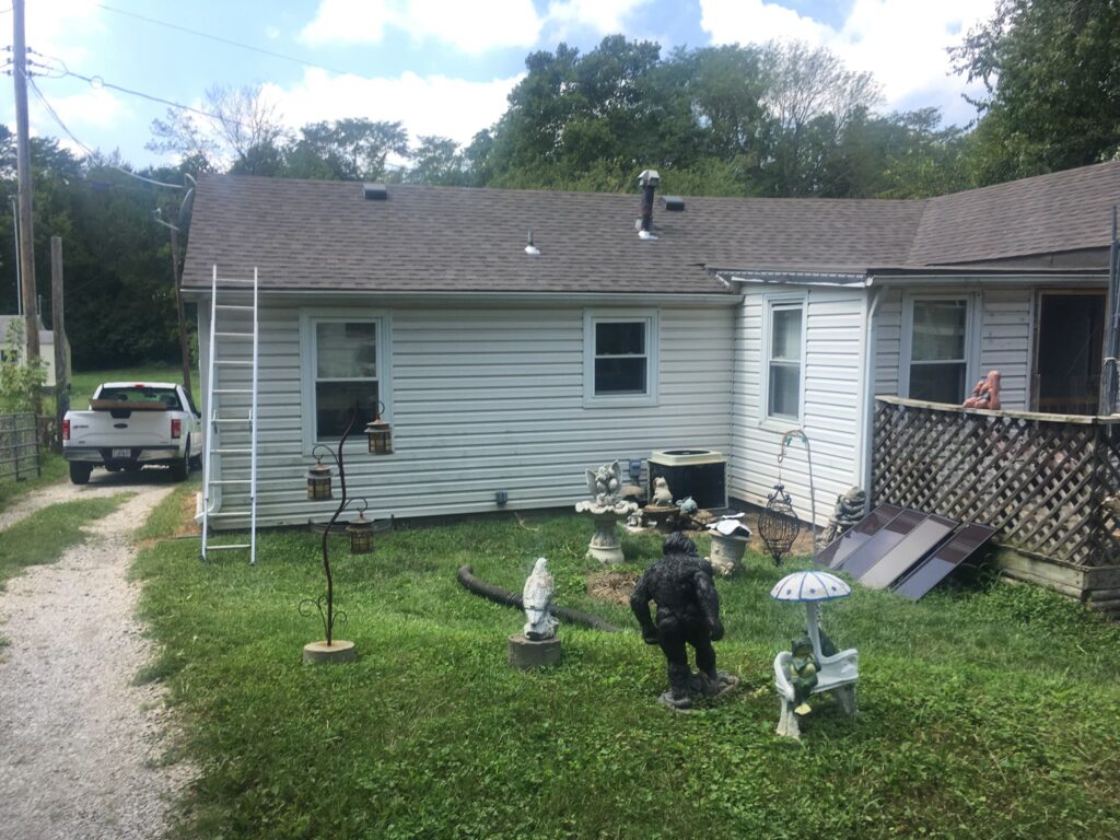 Roofers working on new roof on residential home in Kansas city