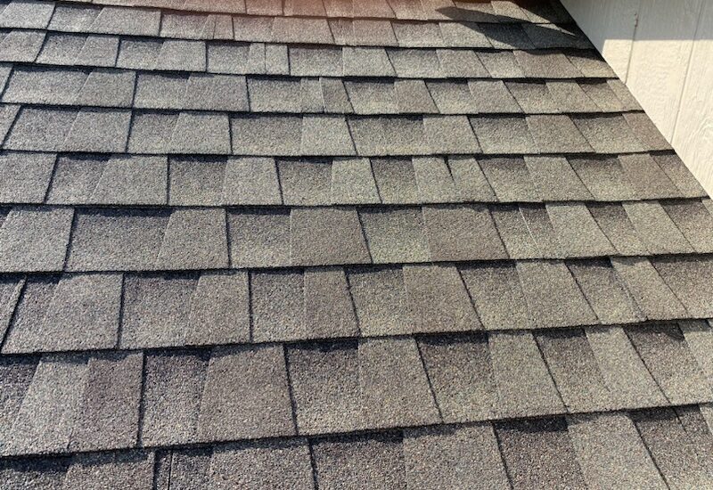 Roofers working on new roof on residential home in Kansas city