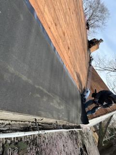 Roofers working on new roof on residential home in Kansas city