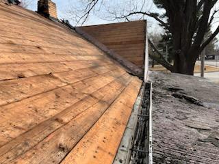 Roofers working on new roof on residential home in Kansas city