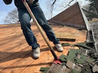 Roofers working on new roof on residential home in Kansas city