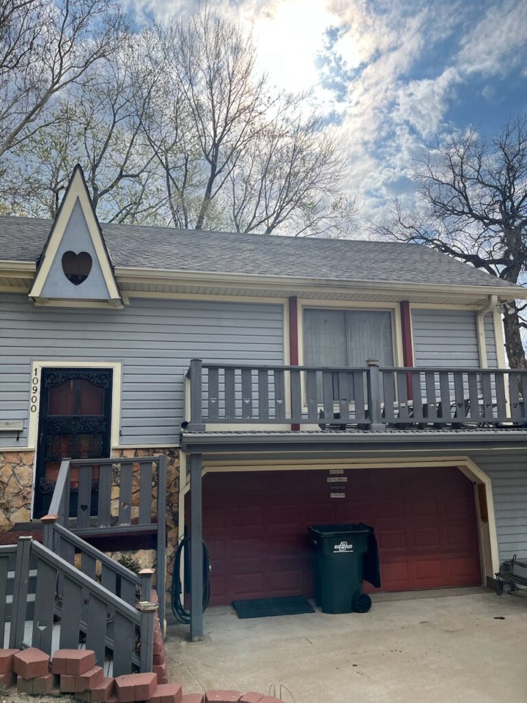 Roofers working on new roof on residential home in Kansas city